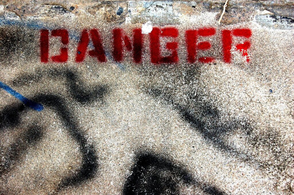 DANGER is painted in red on the road.