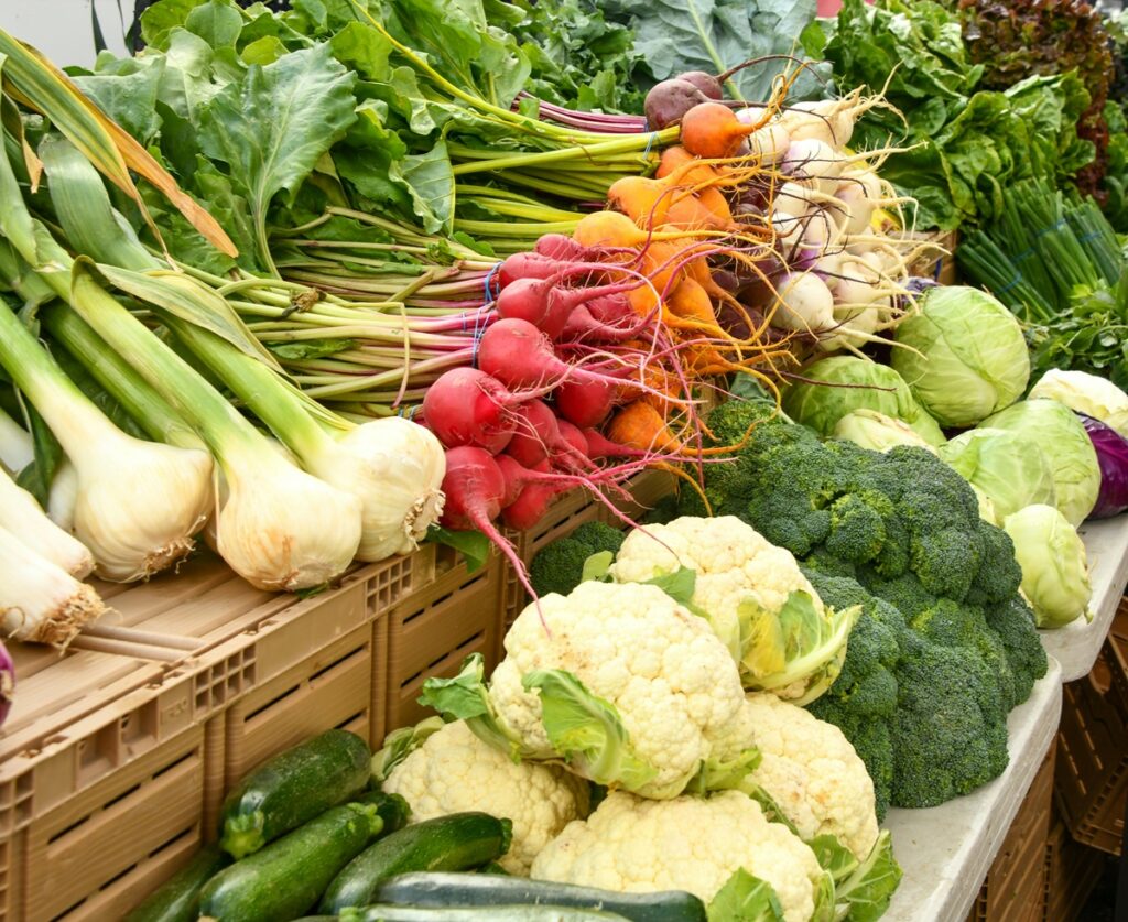 An assortment of veggies, including beets, broccoli, and cabbage.
